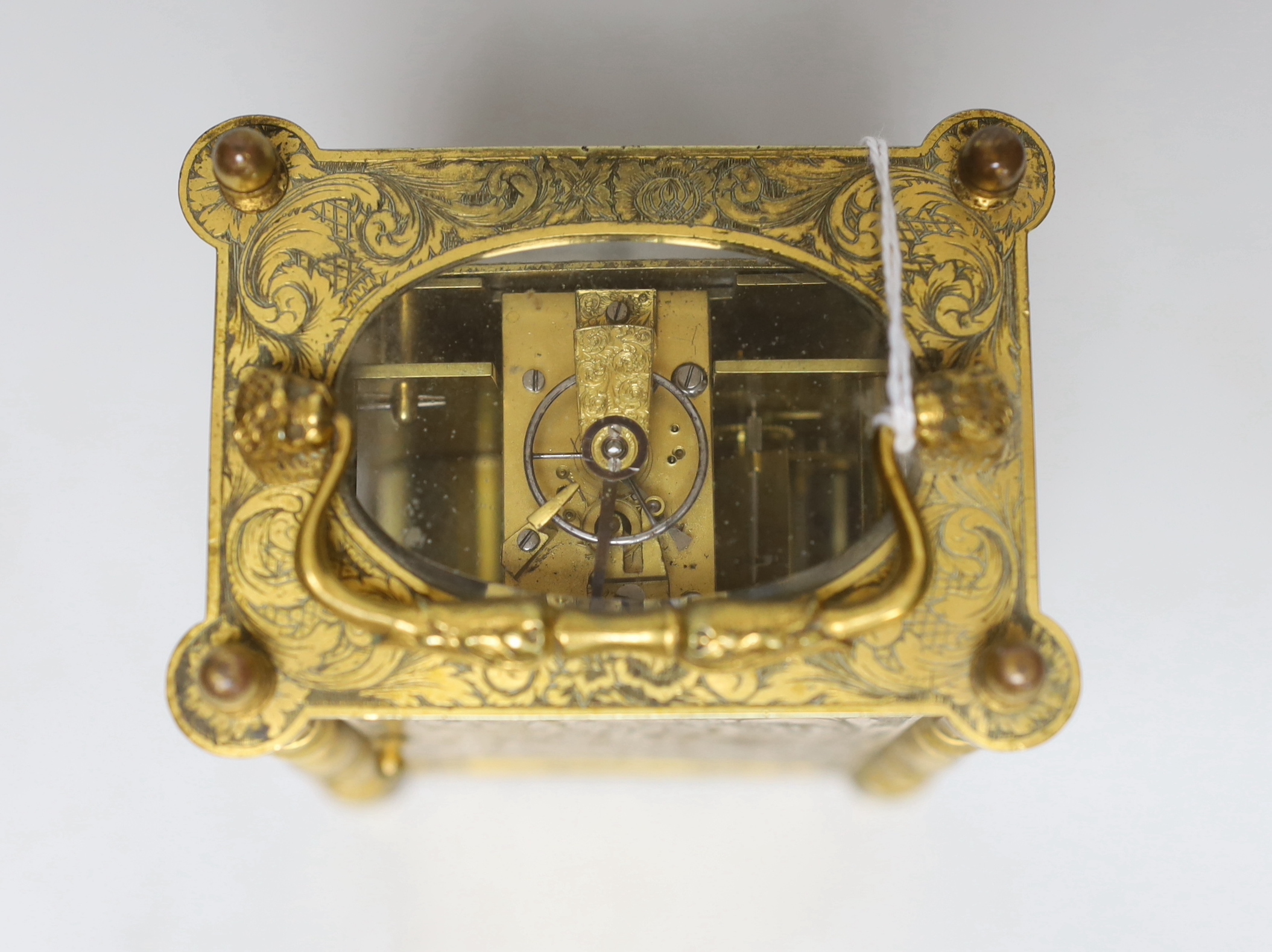 A mid 19th century French engraved gilt brass carriage clock, with tooled leather case, 16cm high